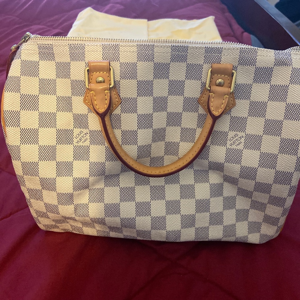 Louis Vuitton medium tip handle bag